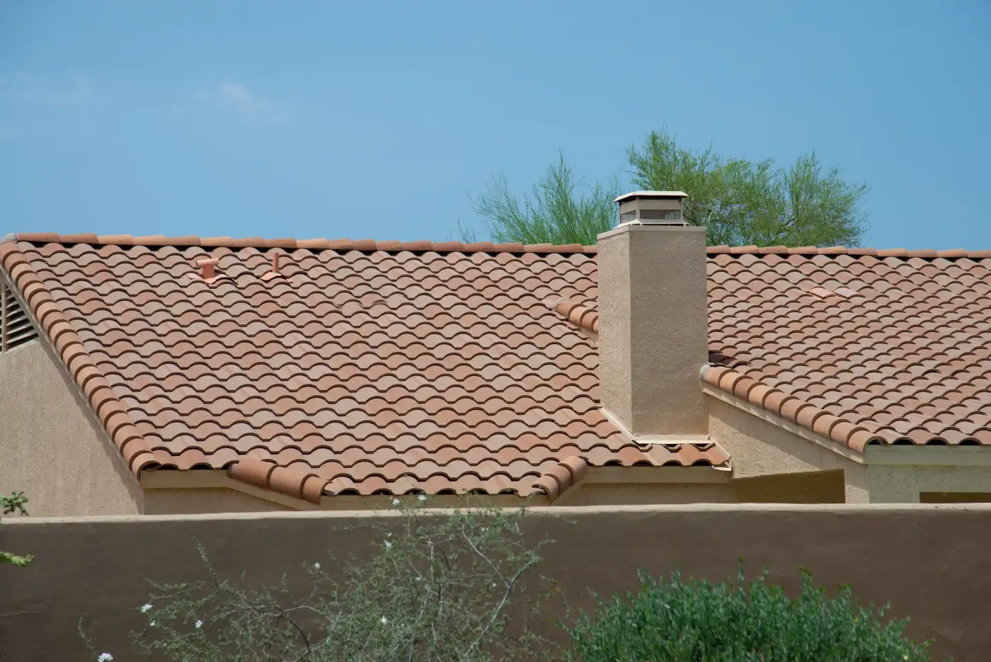 Tile Roof Replacement | Wolfpack Roofing & Exteriors | Austin, TX Front of austin home with new clay tile roof by wolfpack roofing & exteriors